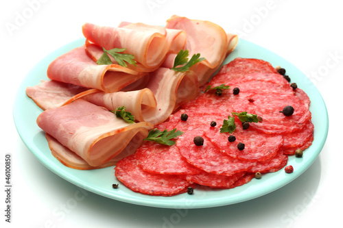 tasty bacon and sausage with spices on plate, isolated on white