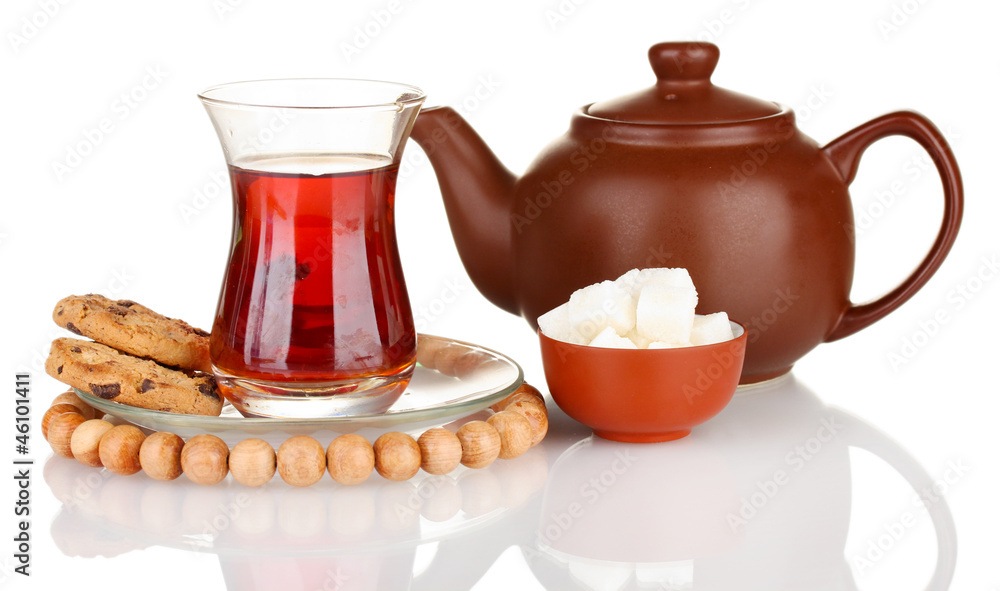 glass of Turkish tea and kettle isolated on white