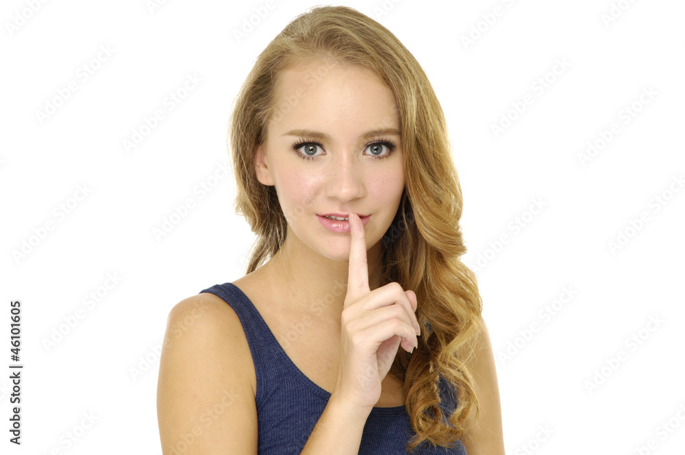 Close up portrait of blond girl asking to keep quiet Close up portrait of blond girl asking to keep quiet
