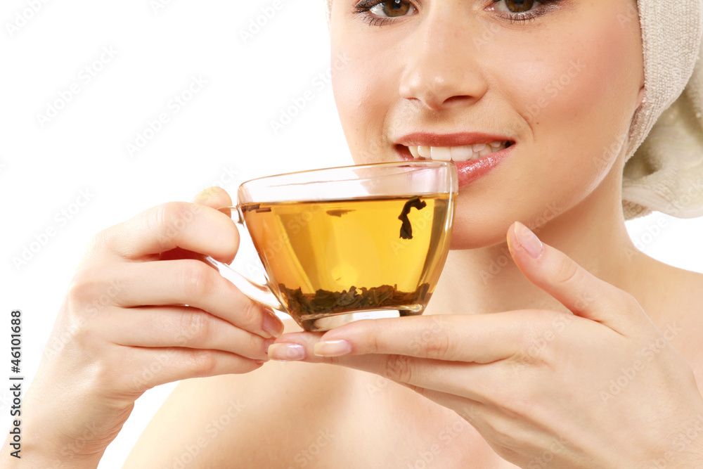 Closeup of a beautiful young woman enjoying tea Closeup of a beautiful young woman enjoying tea