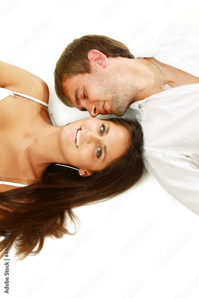 A young couple lying on the floor