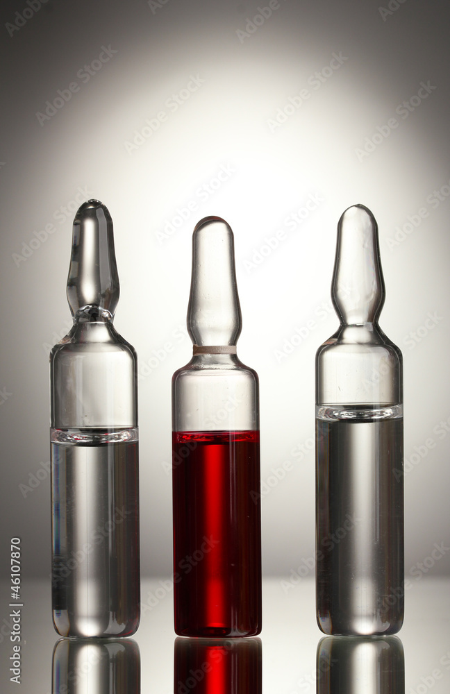 medical ampules on grey background medical ampules on grey background