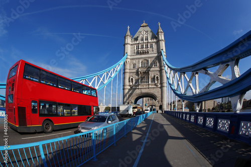 Tower Bridge with red bus in London, UK