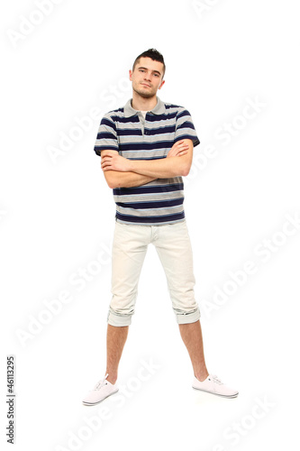 A full-length portrait of a young college guy, isolated on white