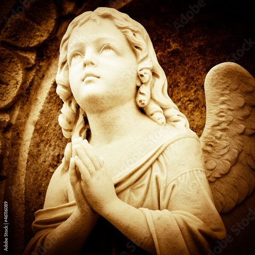 Praying angel in sepia shades photo