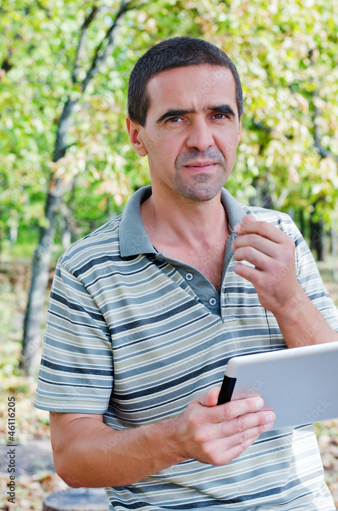 Serious man using a tablet Serious man using a tablet