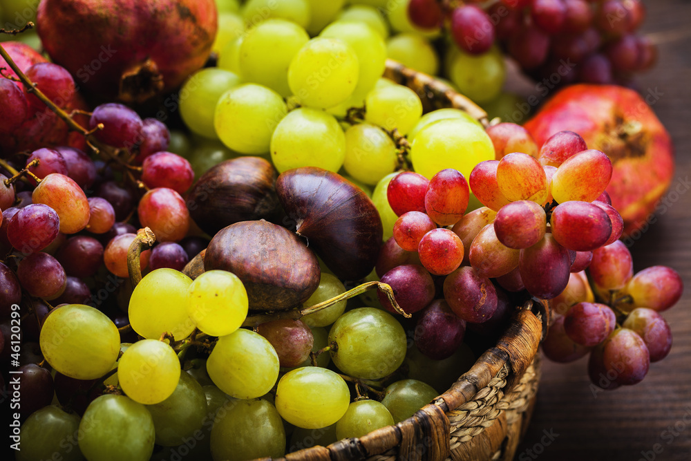 Wicker basket with autumn fruits Wicker basket with autumn fruits