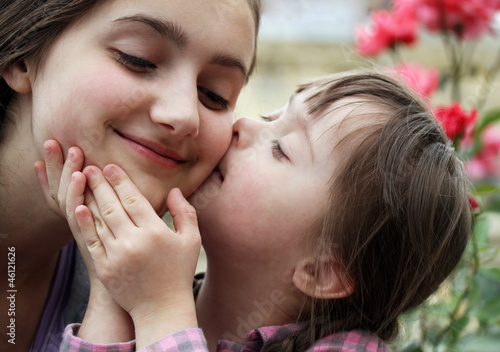 Happy family moments - sister and child have a fun