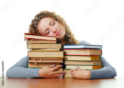  student girl sleeping hugging books