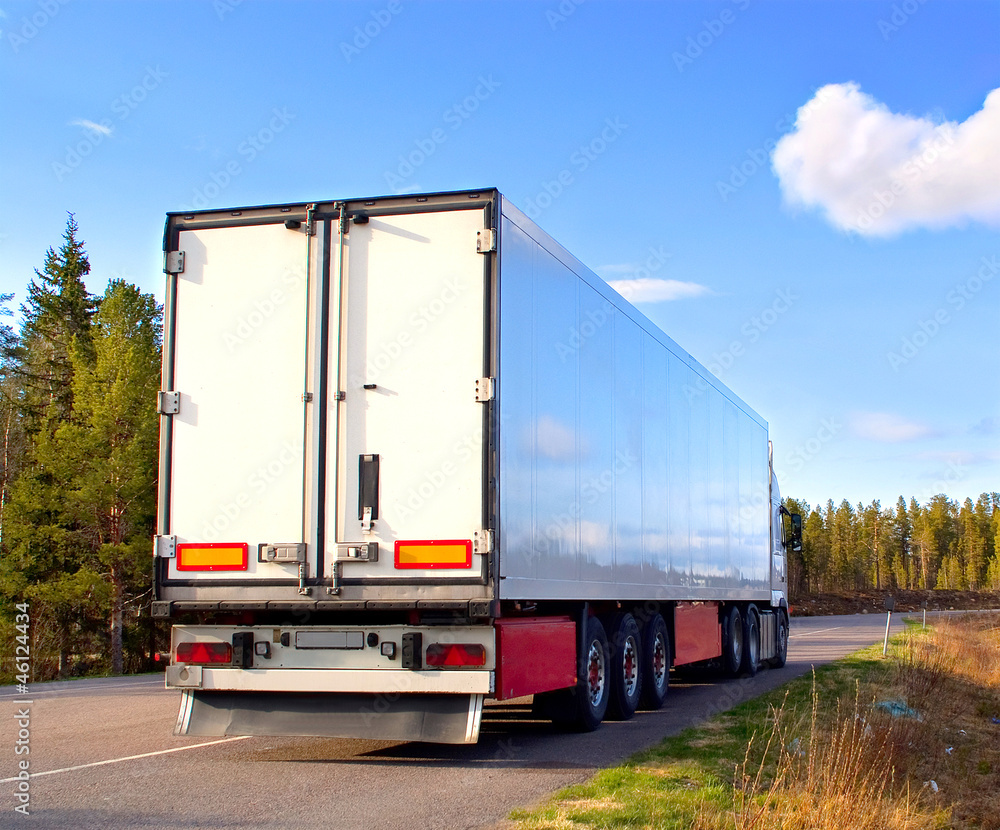 Trailer on the finland road in sunny day Trailer on the finland road in sunny day