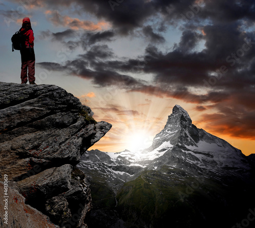 Obraz na plátně girl looking at the beautiful Mount Matterhorn in the Swiss Alps