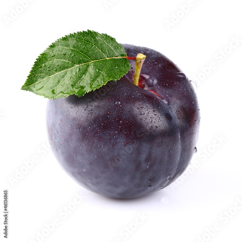 One ripe fresh plum with leaf