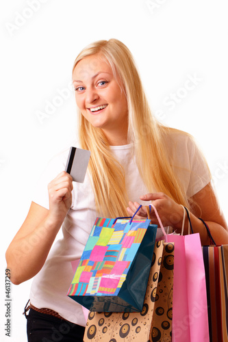 Happy blonde woman with purchases and discount card