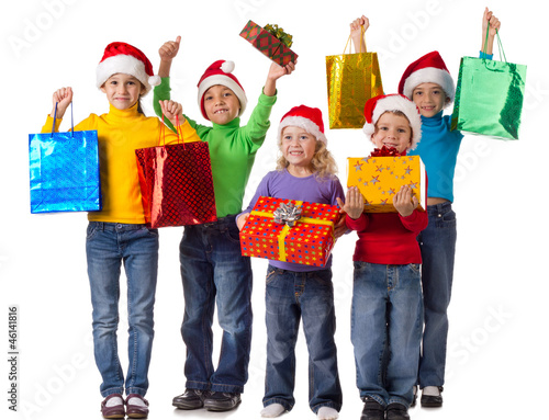 Group of happy kids with christmas gifts