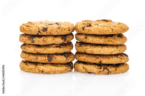 A stacks of chocolate chip cookies isolated on a white backgroun