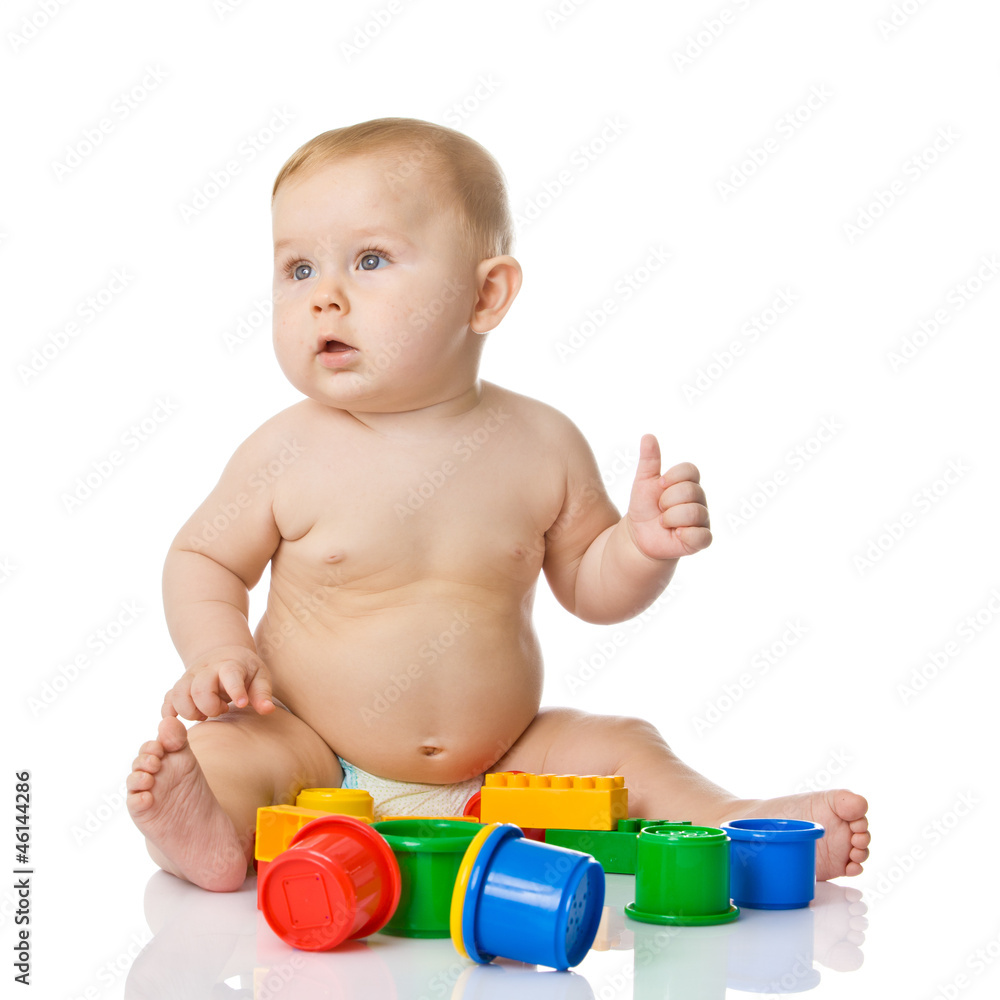 Baby playing with cup toys. Isolated on white background Baby playing with cup toys. Isolated on white background