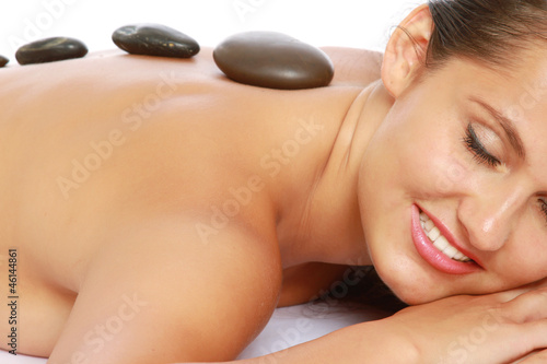 Massage with hot stone