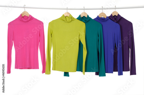 colorful clothing on hanger in a row