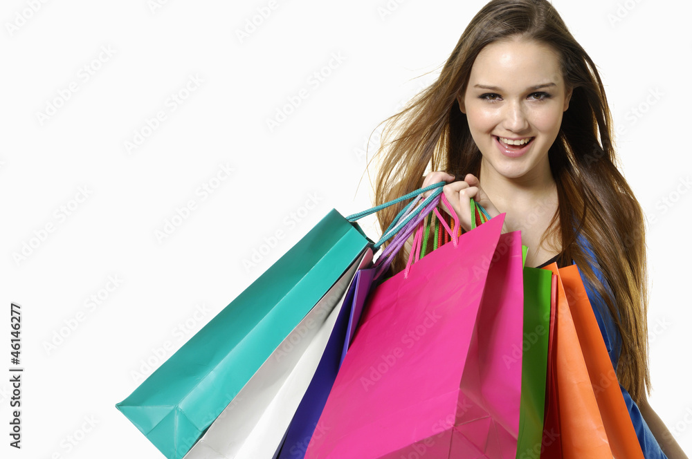 Close up happy shopping girl holding bags Close up happy shopping girl holding bags