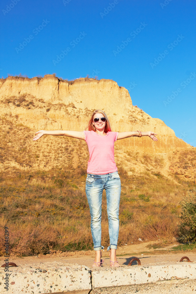 Fototapeta premium girl at a mountain foot