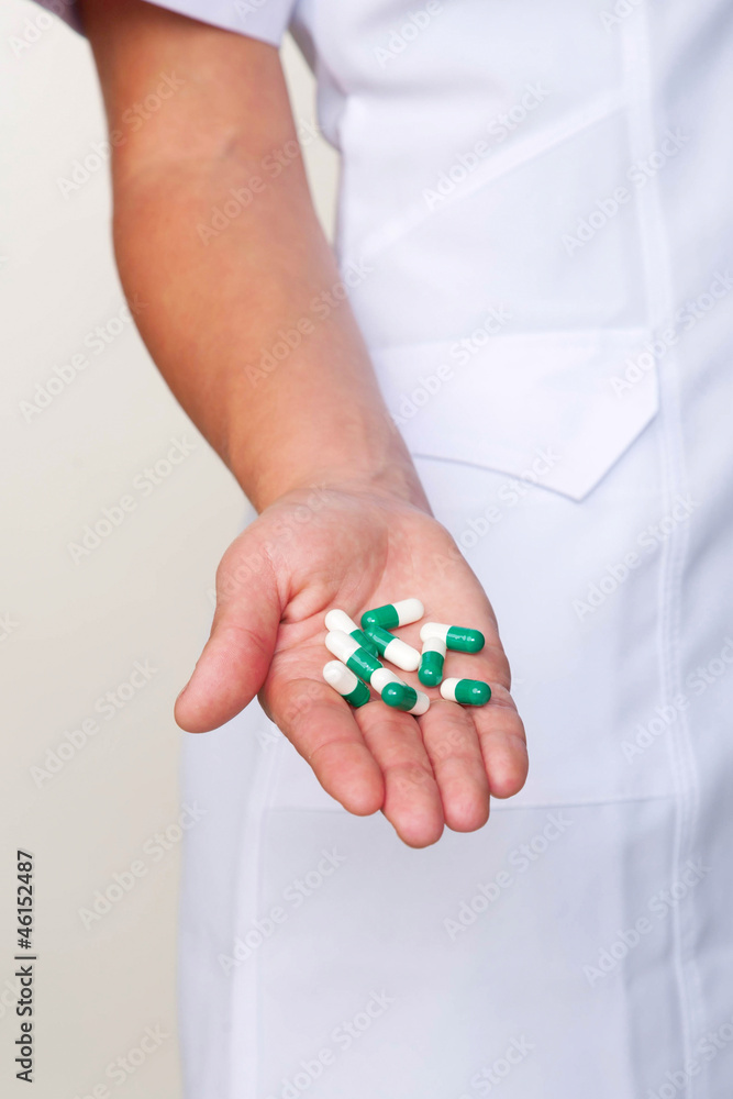 pills or capsules on stretched hand close-up pills or capsules on stretched hand close-up