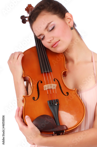 Attractive violinist posing with violin isolated on white