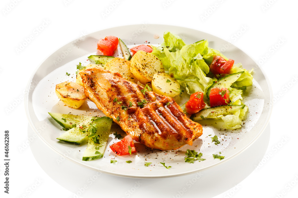 Grilled steaks, baked potatoes and vegetables Grilled steaks, baked potatoes and vegetables