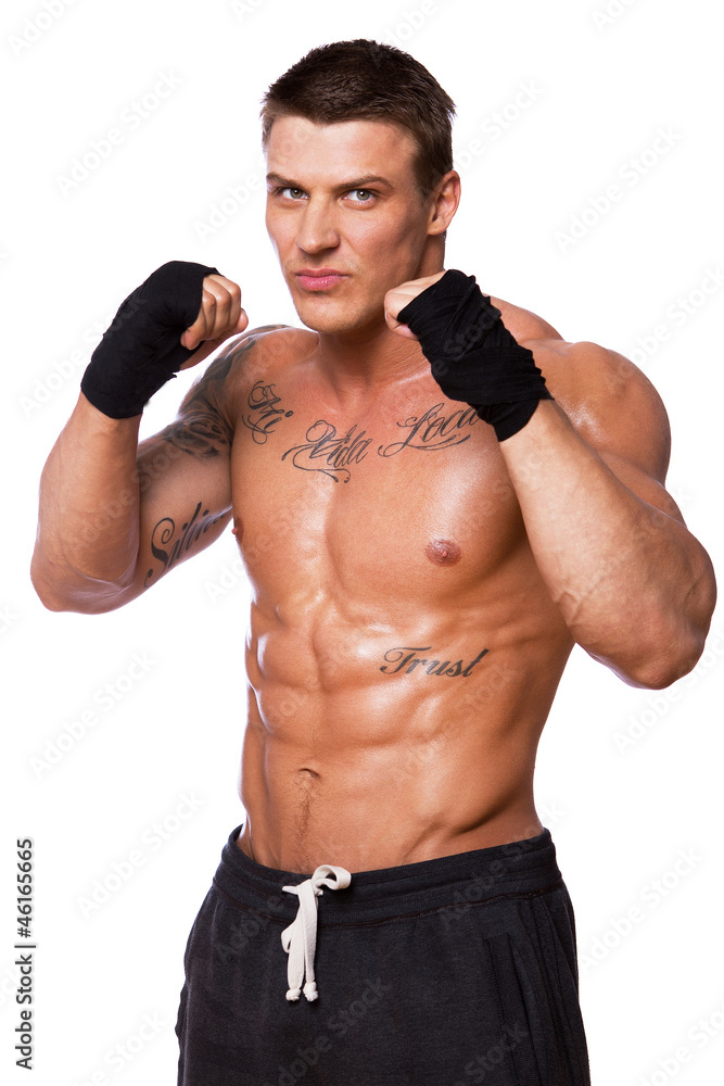 Portrait of handsome bodybuilder posing on white background
