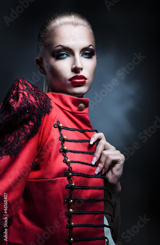 erotic blonde woman in red jacket with red lips