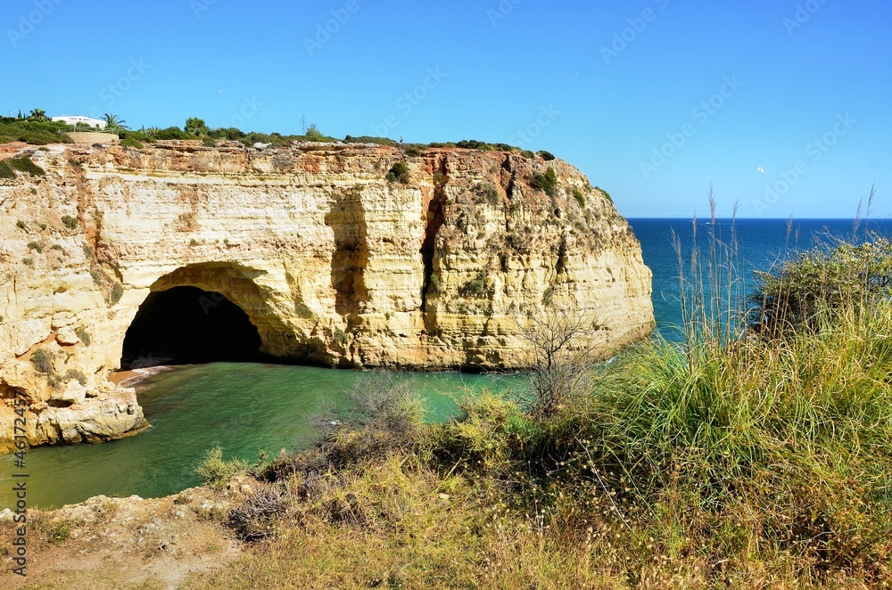 Algarve cliffs forming a bay and caves