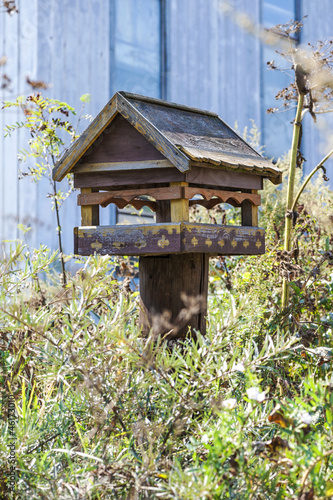 carved wooden trough for birds and squirrels photo