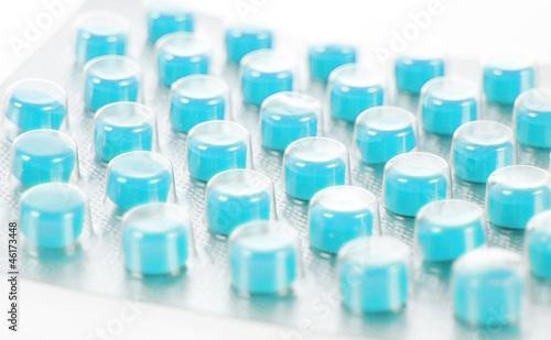 blue pills isolated on white