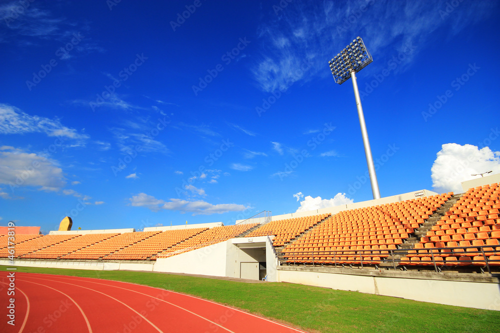 Fototapeta premium run race in stadium against blue sky