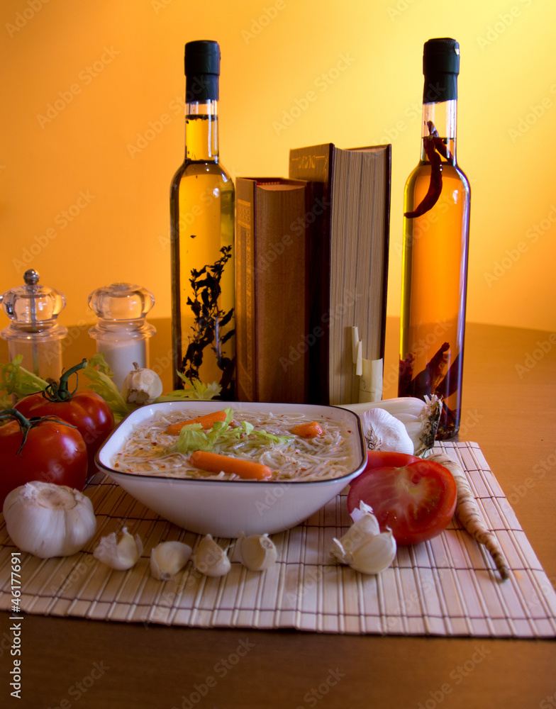 Chicken soup, olive oil and cook books Chicken soup, olive oil and cook books