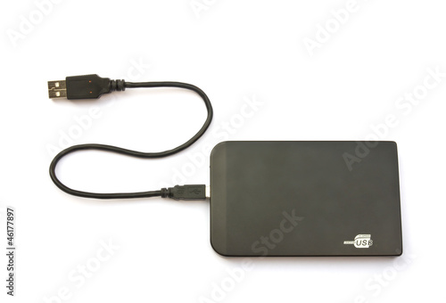Portable external hard disk drive with USB cable on white backgr