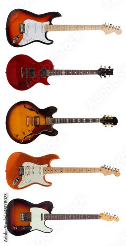 Group of Five Electric guitars on white background photo