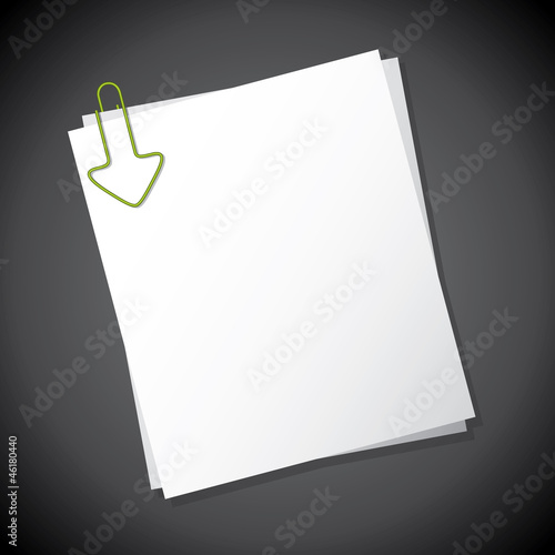 Arrow shaped paper clip pointing towards text