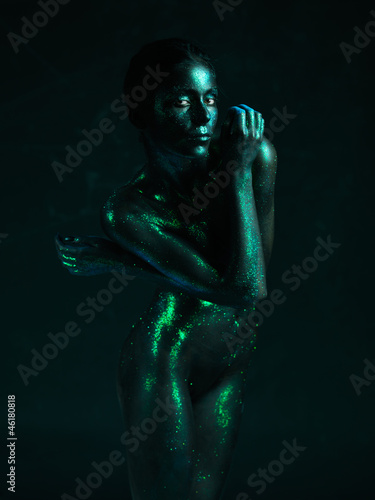 artistic nude of woman shiny blue skin