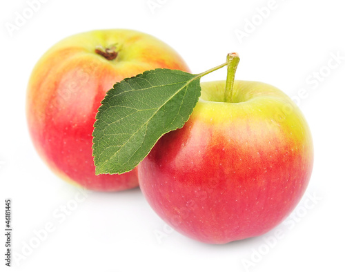 Two apples with leaves
