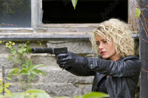 Quadro su tela Female Spy with silencer handgun