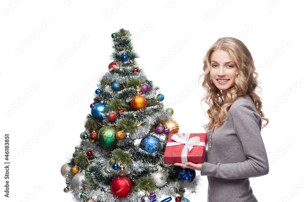 young smiling woman holding christmas gift young smiling woman holding christmas gift
