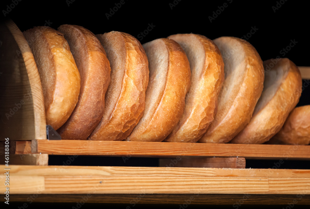 Wooden bakery counter with fresh traditional Russian wheat bread