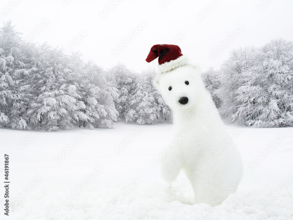 White bear with Santa hat in snowy field