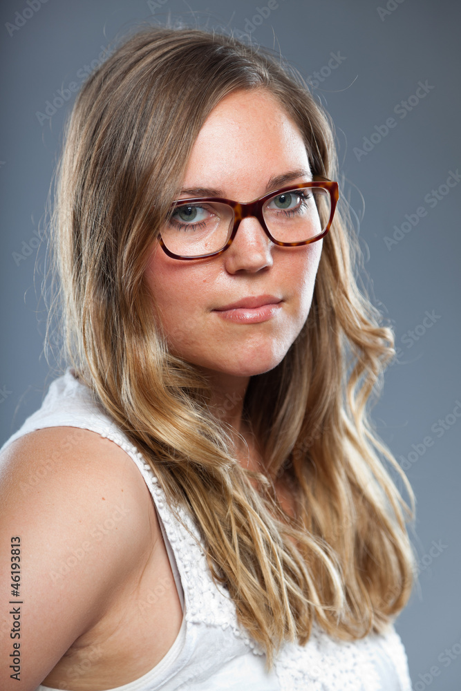 Fototapeta premium Pretty woman with long brown hair wearing glasses. Fashion.