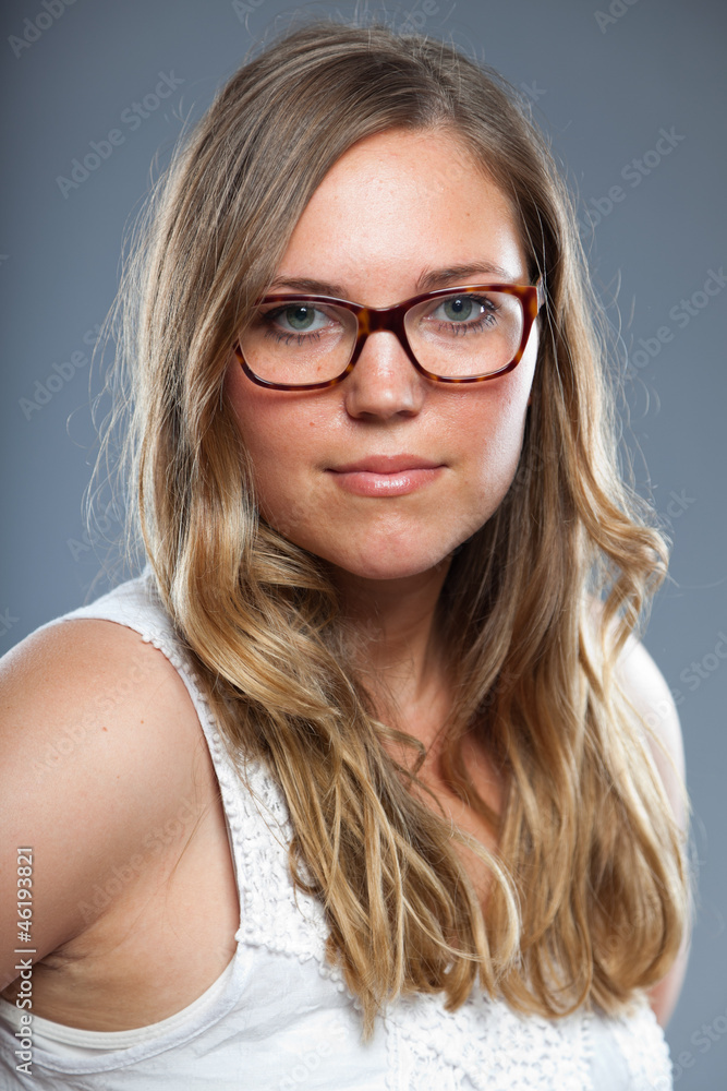 Pretty woman with long brown hair wearing glasses. Fashion. Pretty woman with long brown hair wearing glasses. Fashion.