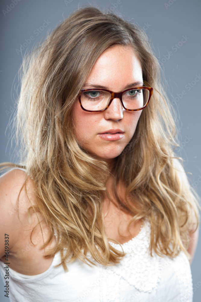 Pretty woman with long brown hair wearing glasses. Fashion. Pretty woman with long brown hair wearing glasses. Fashion.