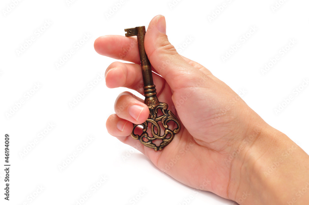 Key in the hand isolated on a white background