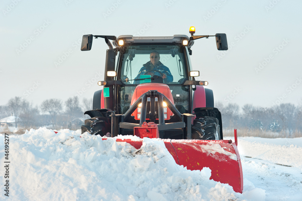 Fototapeta premium Tractor cleaning snow