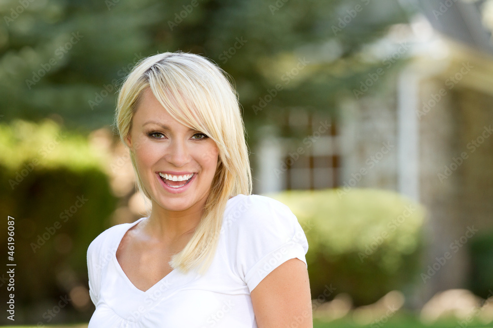 A Young Blonde Woman Outside Laughing A Young Blonde Woman Outside Laughing
