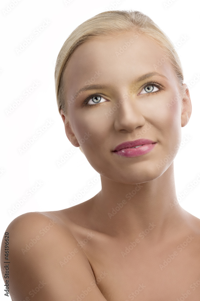 Fototapeta premium portrait of blonde girl with colored make-up, she looks up